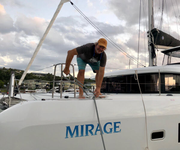 Man getting the anchor of his boat
