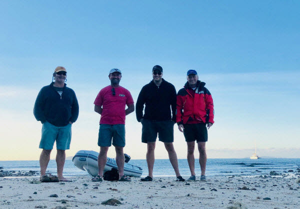 Four men enjoying a vacation at the beach