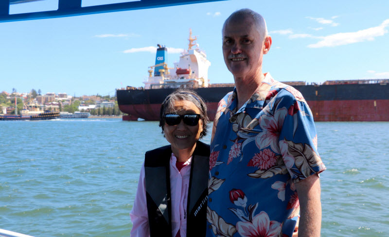 Happy couple riding a boat